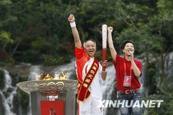 The Olympic torch is carrying through Leshan, Sichuan province.