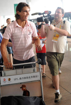 Spanish tennis player Rafael Nadal speakes to reporters upon his arrival at the Beijing Capital International Airport in Beijing, China, Aug 4, 2008.