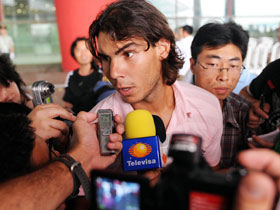 Spanish tennis player Rafael Nadal speaks to reporters at the Beijing Capital International Airport in Beijing, China, Aug 4, 2008. Nadal arrived here Monday for the Olympic tennis event which will start on Aug 10.