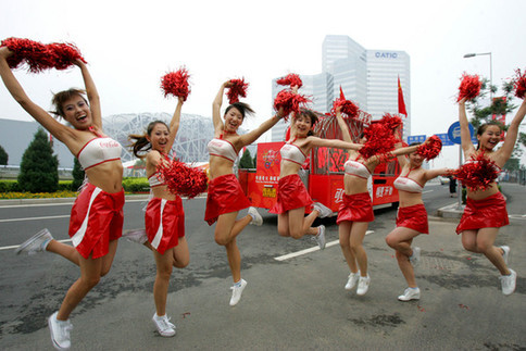 Cheerleaders dance August 4 near the National Stadium. They will join the Beijing leg of the torch relay August 6. [ChinaFotoPress] 