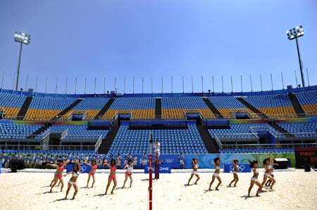 Members of 'Dance Fashion' cheering squad train on burning sands at Chaoyang Park Beach Volleyball Ground in Beijing, China, Aug. 2, 2008.