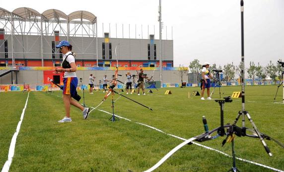 Olympic archers from Columbia and Belarus are making adaptation training and test in the archery field of Bejing Olympic Park on July 31