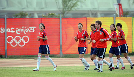 The Chinese women's football team in high spirits during training at Tianjin Olympic Center Stadium, August 4, 2008. 