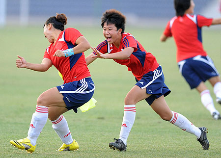 A light hearted warm up for the Chinese women's football team at the Tianjin Olympic Center Stadium, August 4, 2008. 