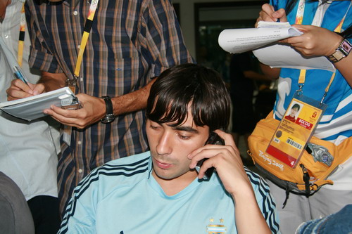 Lavezzi from Argentina Olympic soccer team is answering questions from reporters on August 5. 