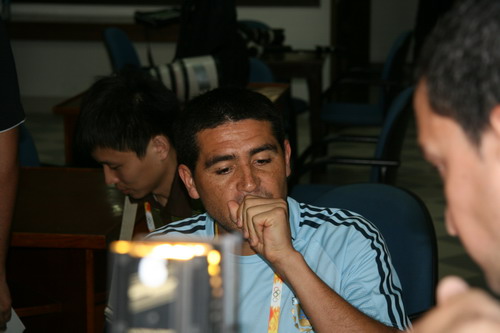 Riquelme is answering questions from reporters on August 5. 