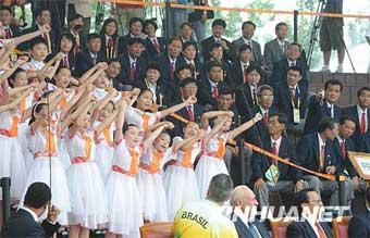 Children from the Democratic People's Republic of Korea sing during the raising flag ceremony.