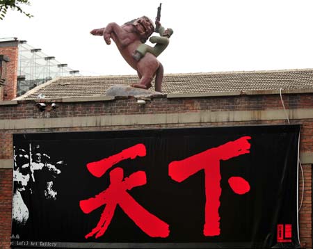 Photo taken on Aug. 5, 2008 shows a sculpture called "Soldiers from Heaven" on the roof of a building at 798 Art Zone in Beijing, capital of China.