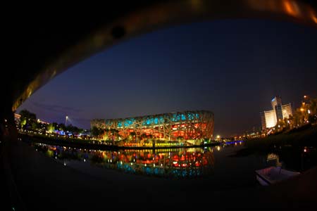Photo taken on Aug. 5, 2008 shows the National Stadium, nicknamed the Bird&apos;s Nest, in the evening in Beijing, China. Beijing witnessed a fine weather Tuesday. (Xinhua/Guo Lei) 