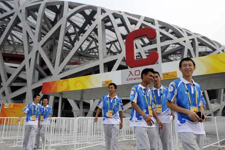 Some volunteers prepares for dress rehearsal of the opening ceremony of Beijing 2008 Olympic Games at C3 gate of the National Stadium, nicknamed the Bird&apos;s Nest, in Beijing, China, Aug. 5, 2008. (Xinhua/Li Ziheng) 