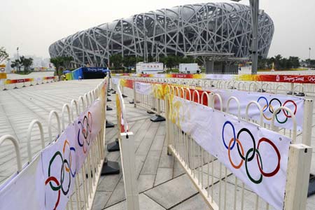 Photo taken on Aug. 5, 2008 shows fences outside the National Stadium, nicknamed the Bird&apos;s Nest, before a dress rehearsal of the opening ceremony of Beijing 2008 Olympic Games in Beijing, China. (Xinhua/Li Ziheng)