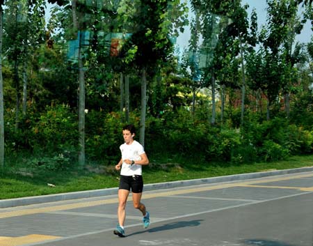 The Olympic Village, located in the Olympic Green in north Beijing and divided into three sections of the international area, residential area and operations area, houses about 16,000 athletes, coaches and their entourage from over 200 countries and regions coming for the Olympics. (Xinhua/Zhang Guojun) 