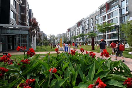 The Olympic Village, located in the Olympic Green in north Beijing and divided into three sections of the international area, residential area and operations area, houses about 16,000 athletes, coaches and their entourage from over 200 countries and regions coming for the Olympics. (Xinhua/Zhang Guojun) 