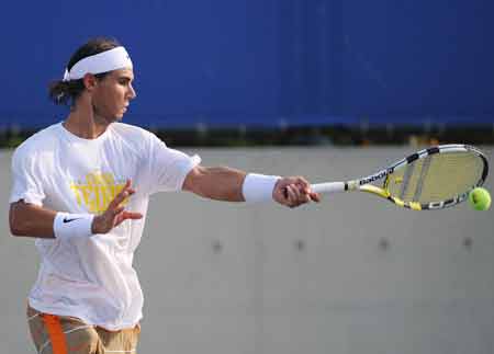 Spanish tennis player Rafael Nadal attends a training session at the Beijing Olympic Green Tennis Court in Beijing, China, Aug. 5, 2008. Nadal had his first training after his arrival at Beijing on Tuesday. He will participate in the Olympic tennis event which will start on Aug. 10. 