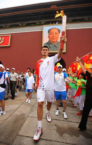 Yao Ming carries the Olympic torch in Beijing August 6.