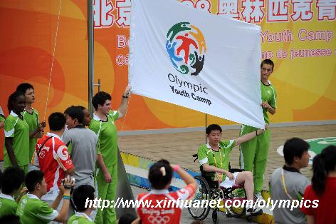 Photo taken on Aug. 6, 2008 shows the flag-raising ceremony of the Beijing 2008 Olympic Youth Camp in the Beijing 101 Middle School in Beijing, China. The Olympic Youth Camp officially opened on Wednesday is an integrant part of the Olympic Games and is of great significance in carrying forward the Olympic Movement. [Zhang Ling/Xinhua]