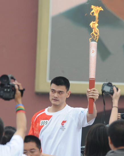 Basketball superstar Yao Ming is the ninth torch bearer.