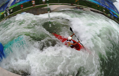 Amongst the white water an Olympic canoeists bravely fights the rapids at Shunyi Olympic Rowing-Canoeing Park north of Beijing August 5, 2008. [Xinhua]