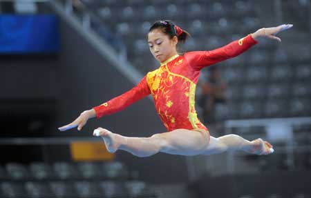 Chinese gymnast Jiang Yuyuan practices balance beam at the National Indoor Stadium in Beijing, China, Aug. 7, 2008. 