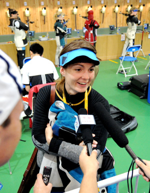 Katerina Emmons of Czech receives interviews after the training in Beijing, China, Aug. 4, 2008. Lots of sharp shooters aiming for the Beijing Olympics had adaptability trainings here on Monday. The shooting events of the Beijing 2008 Olympic Games will be held from Aug. 9 to 17 in Beijing. [Xinhua]