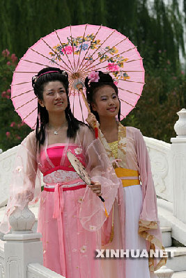 Girls display Hanfu costumes in park to celebrate the Chinese valentine's day.