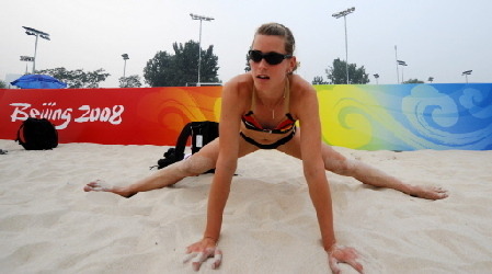 Germany's Laura Ludwig streches during a training session at the Olympic beach volleyballl centre in Chaoyang Park in Beijing on August 4,2008. The 2008 Beijing Olympic Games will take place in China between August 8 and 24. [China Daily/Agencies]