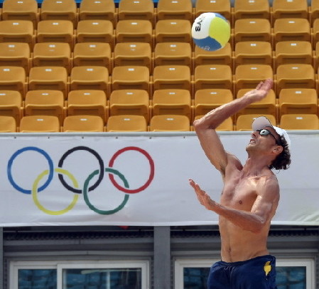 Brazil's Emanuel Rego smashes during practice at Beijing's Chaoyang Park Beach volleyball ground on August 6, 2008, two days before the opening of the 2008 Beijing Olympic Games. The Brazilian Pair Emanuel-Ricardo is one of the favorite with their US counterparts Rogers-Dalhausser for the gold medal. [China Daily/Agencies]