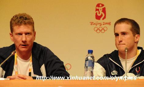 US head coach Kavin Mazeika (L) speaks while gymnast Morgan Hamm listens at the press conference held in the Main Press Center in Beijing, China, Aug. 7, 2008. Morgan Hamm announced here on Thursday that he withdrew from the US men gymnastics team for health reasons. [Xinhua]