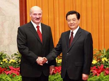 Chinese President Hu Jintao (R) shakes hands with Belarusian President Alexander Lukashenko during their meeting in Beijing, China, Aug. 7, 2008. Alexander Lukashenko is here to attend the opening ceremony of the Beijing Olympic Games and other events. [Xinhua]