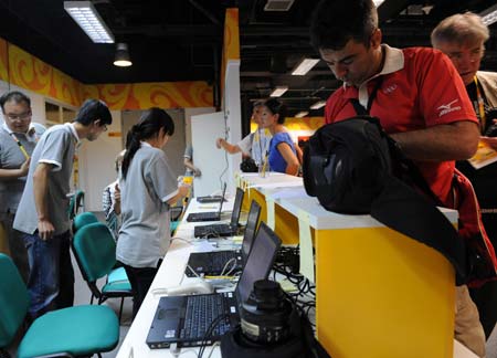 Journalists start their work at the Main Press Center (MPC) in the Olympic Green in Beijing, China, at about 9 a.m. on Aug 8, 2008, 11-hour countdown to the opening ceremony of the Olympics. The opening ceremony of the Beijing 2008 Olympic Games will be held in the National Stadium at 8 p.m. on Aug 8. [Xinhua] 