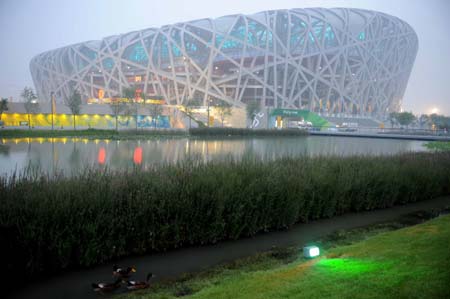 Photo taken at around 05:00 on Aug 8, 2008 shows the National Stadium, namely the Bird's Nest, in Beijing, China, 15-hour countdown to the opening ceremony of the Olympics. The opening ceremony of the Beijing 2008 Olympic Games will be held in the National Stadium at 8 p.m. on Aug 8. [Xinhua] 