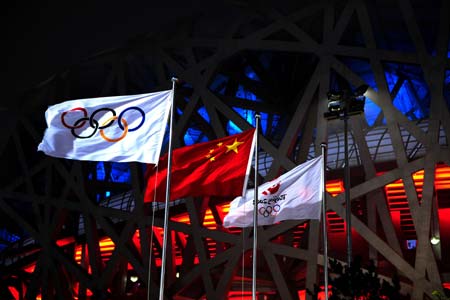 The Olympic flags and the Chinese national flag flutter near the National Stadium, namely the Bird's Nest, in Beijing, China, at 03:00 on Aug 8, 2008, 17-hour countdown to the opening ceremony of the Olympics. The opening ceremony of the Beijing 2008 Olympic Games will be held in the Bird's Nest at 8 p.m. on Aug 8.[Xinhua] 