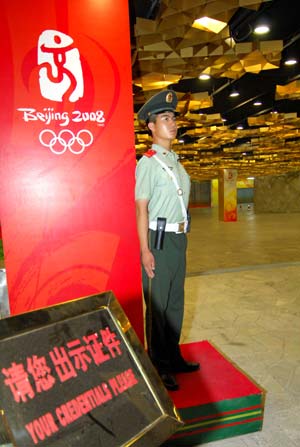An armed policeman stands guard at the entrance of the National Stadium, namely the Bird&apos;s Nest, in Beijing, China, at about 04:00 on Aug. 8, 2008, 16-hour countdown to the opening ceremony of the Olympics. The opening ceremony of the Beijing 2008 Olympic Games will be held in the Bird&apos;s Nest at 8 p.m. on Aug. 8. [Xinhua]