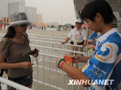 Spectators are entering the National Stadium for the Olympic opening ceremony in Beijing August 8. [Xinhua]