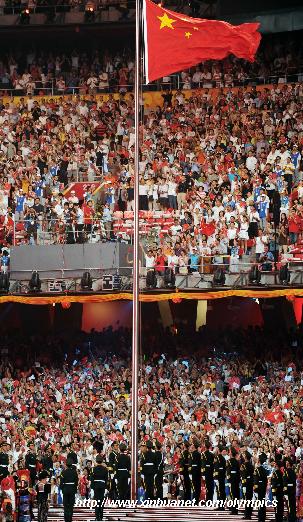 Chinese national flag is hoisted aloft during the opening ceremony of the Beijing Olympic Games held in the National Stadium, also known as the Bird's Nest, in north Beijing, China, Aug. 8, 2008. [Li Ga/Xinhua]