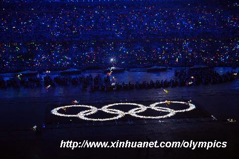 Photo taken on Aug. 8, 2008 shows the shining Olympic rings on a huge LED screen, proclaiming the arrival of the Olympiad at the opening ceremony of the Beijing 2008 Olympic Games in the National Stadium, known as the Bird's Nest, in north Beijing, China. [Yang Lei/Xinhua]