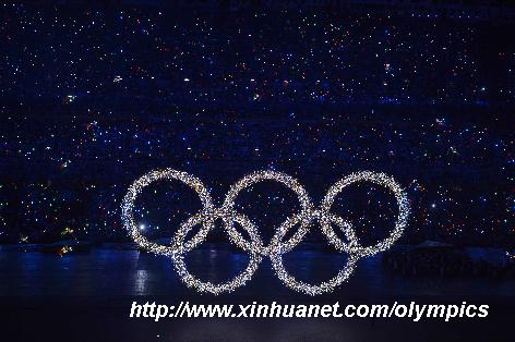 Photo taken on Aug. 8, 2008 shows the shining Olympic rings on a huge LED screen, proclaiming the arrival of the Olympiad, during the opening ceremony of the Beijing 2008 Olympic Games in the National Stadium, or the Bird's Nest, Beijing, capital of China. [Yang Lei/Xinhua] 