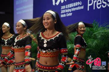 Cheerleaders keep smiling during the whole performance.