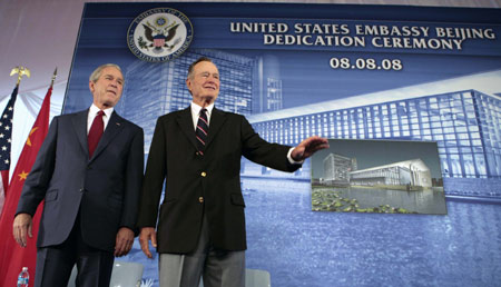US President George W. Bush (L) and his father, former US President George H.W. Bush, attend the dedication of the new US embassy in Beijing August 8, 2008. 