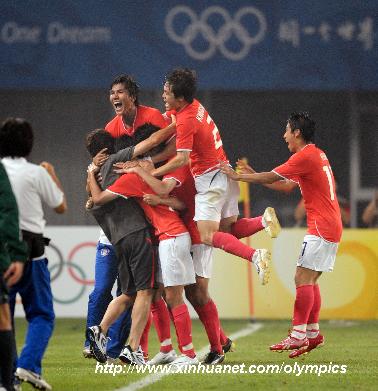 South Korea player celebrate after a goal during the Beijing Olympic Games men's football Group D first round match against Cameroon in Qinhuangdao