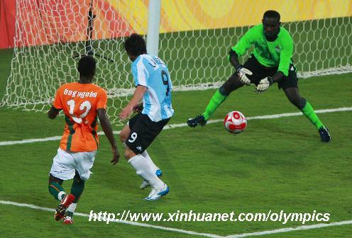Goalkeeper Vincent Angban of Cote D'Ivoire blocks a shot during the Beijing Olympic Games men's football Group A match against Argentina at Shanghai Stadium