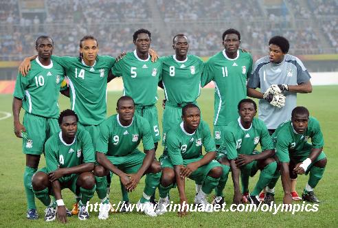 Players of Nigeria pose for group photo prior to the Beijing Olympic Games men's football Group B match between Netherlands and Nigeria at Tianjin Olympic Center Stadium.