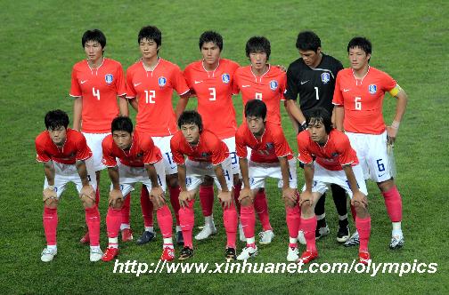 Members of South Korea men's football team pose for picture before the Beijing Olympic Games men's football Group D first round match against Cameroon in Qinhuangdao.