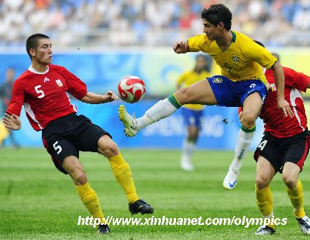 Brazilian striker Pato (C) stops the ball during the first round match of men's football between Brazil and Belgium at the Beijing Olympic Games in Shenyang.