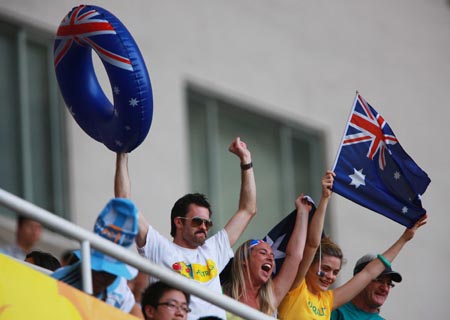 Australian football fans cheer for their team during the Beijing Olympic Games men's football Group A first round match between Serbia and Australia at Shanghai Stadium in Olympic co-host city Shanghai, east China, Aug. 7, 2008.