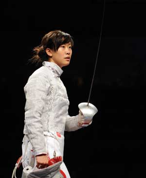 Tan Xue of China completes her match during the women's individual sabre round of 32 at the Beijing 2008 Olympic Games in Beijing, China, Aug. 9, 2008. [Xinhua]