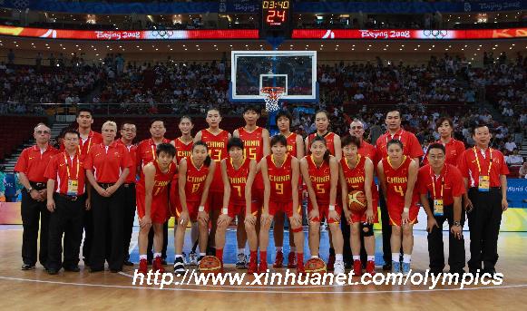 Members of Chinese women's basketball team pose for photos prior to the women's preliminary round group B of Olympic basketball event against Spain at Beijing 2008 Olympic Games at the Beijing Olympic Basketball Gymnasium in Beijing, China, Aug 9, 2008. [Xinhua] 