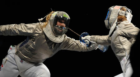 Zagunis(L) of the United States competes against her teammate Becca Ward during the women's individual sabre semifinal 2 at the Beijing 2008 Olympic Games, in Beijing, China, Aug 9, 2008. Zagunis beat Ward in the bout. [Xinhua] 