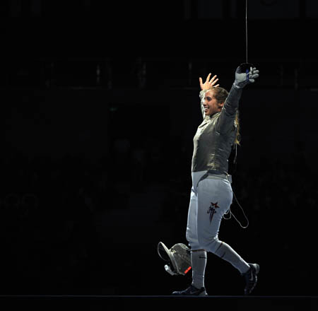 Mariel Zagunis of the United States celebrates after defeating her compatriot Sada Jacobson during the women's individual sabre gold medal match at the Beijing 2008 Olympic Games, in Beijing, China, Aug 9, 2008. Zagunis won the gold medal. [Xinhua] 
