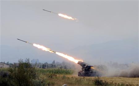 Georgian troops fire rockets at a South Ossetian territory near a settlement in Ergneti, 95 km (59 miles) from Tbilisi, August 8, 2008. (Xinhua/Reuters Photo)